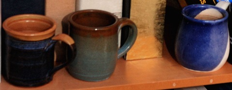 Three past-favorite coffee mugs hiding from the hammer